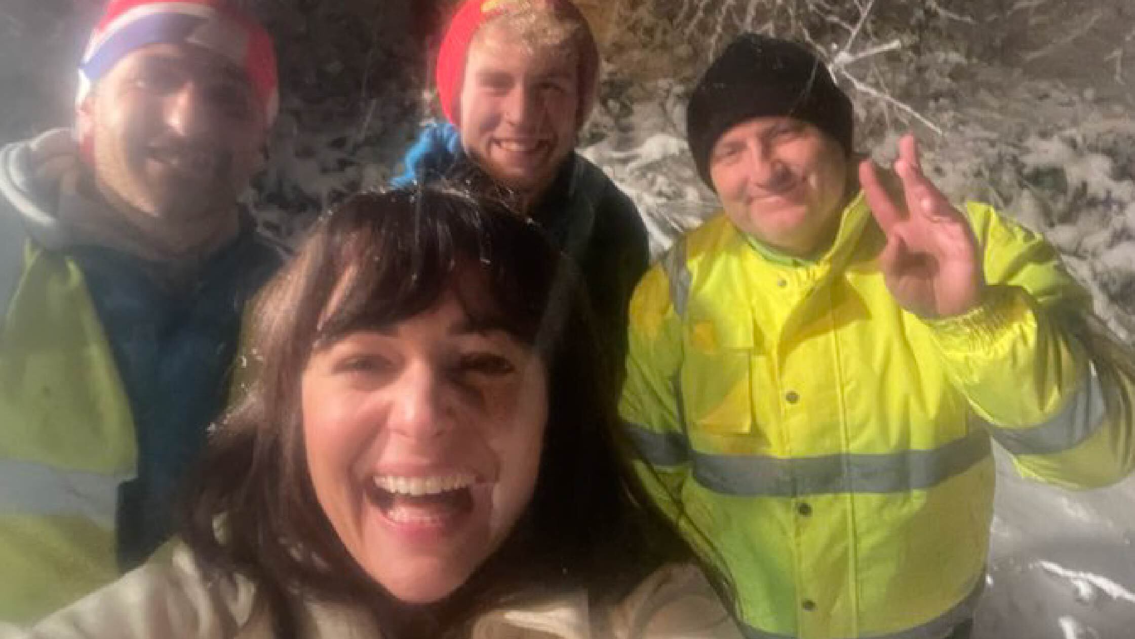 Victoria taking a group selfie with her friends. 