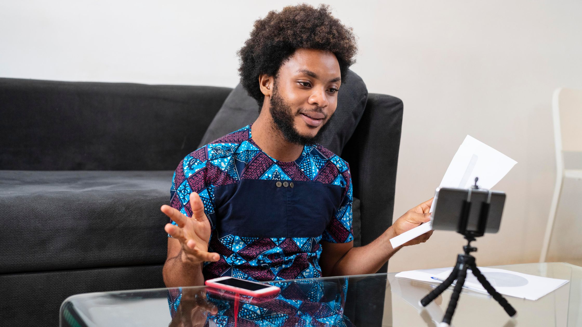 Young man making videos using his smartphone