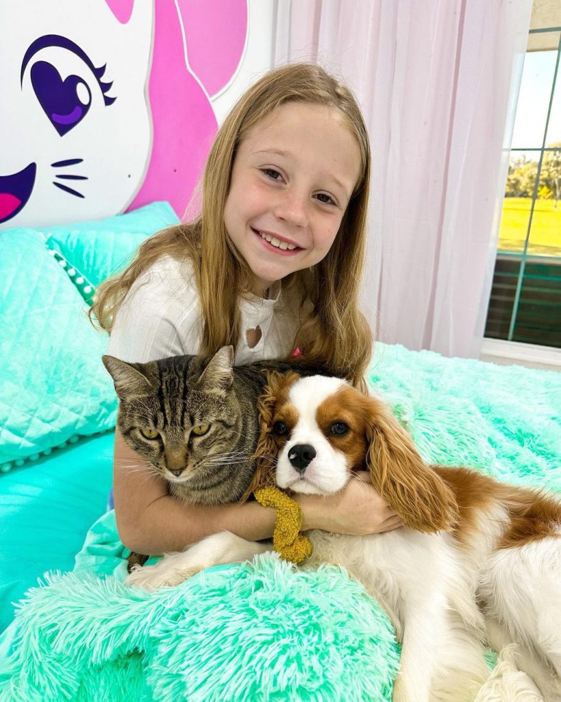 Nastya sitting with her pets