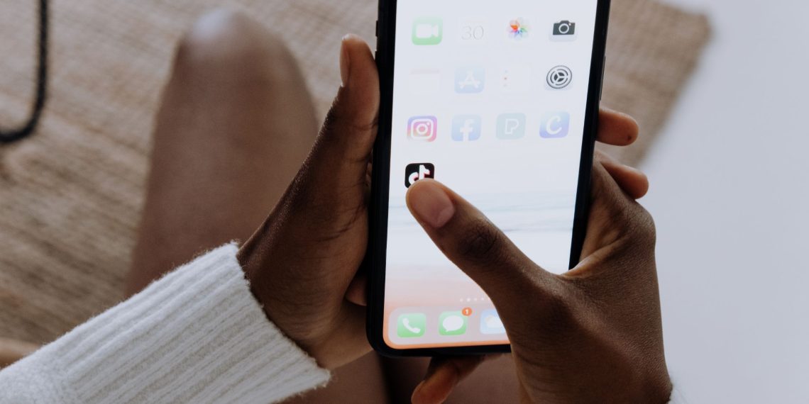 A girl clicking on tiktok app