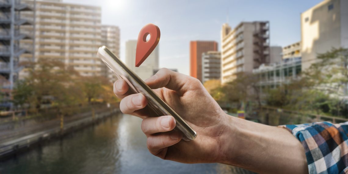 A man holding phone and sharing location.