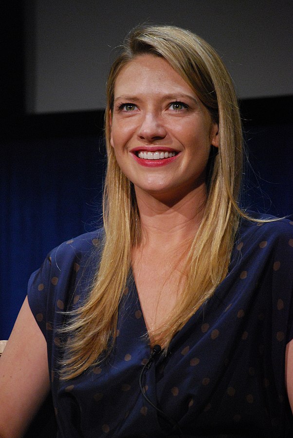 Anna wearing a navy blue colored dress.