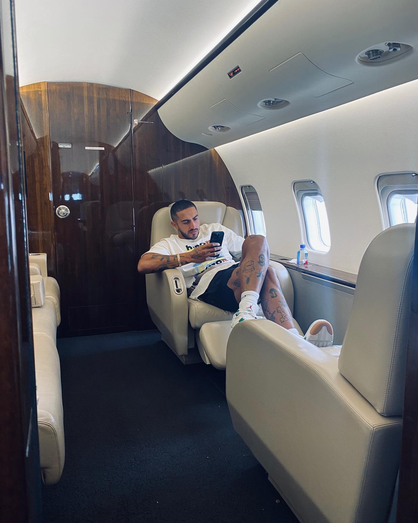 Aisan sitting in his private jet.