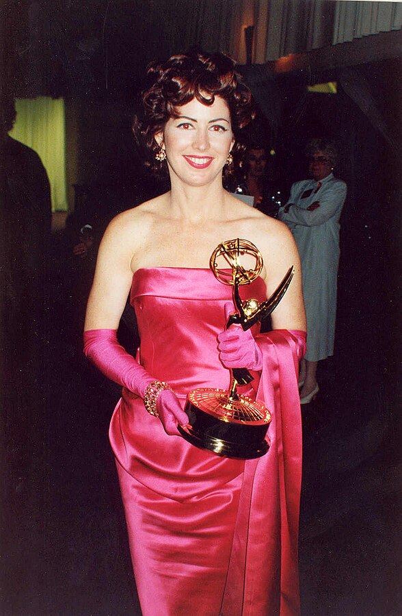 Dana wearing pink dress at Emmy Awards.